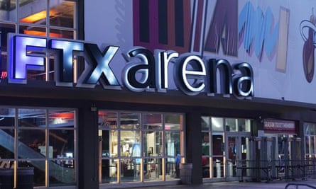 Illuminated sign FTX Arena outside the colorfully painted sports stadium