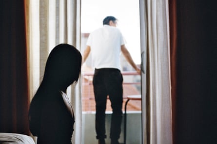 a woman looking at a man