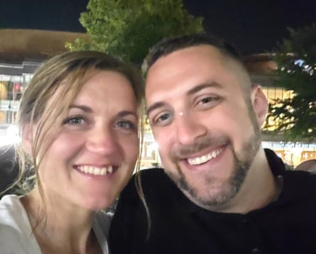 a woman and a man smile