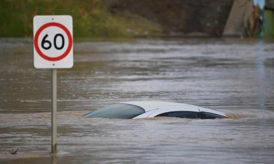 A car is seen submerged by flood water in Traralgon, Victoria, Thursday, June 10, 2021.