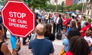 Activists at a demonstration honoring the victims of the El Paso and Dayton mass shootings, in Miami, Florida, 6 August 2019.