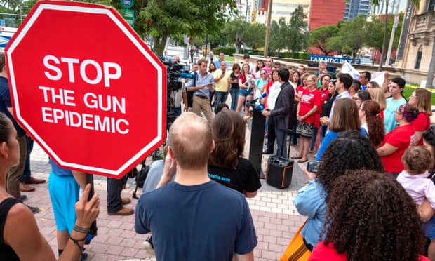 Activists at a demonstration honoring the victims of the El Paso and Dayton mass shootings, in Miami, Florida, 6 August 2019.