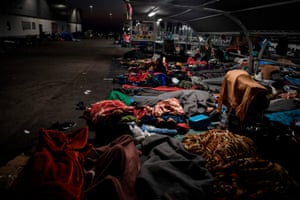 Migrants sleep rough at a supermarket car park near Mytilene on the Greek island of Lesbos.