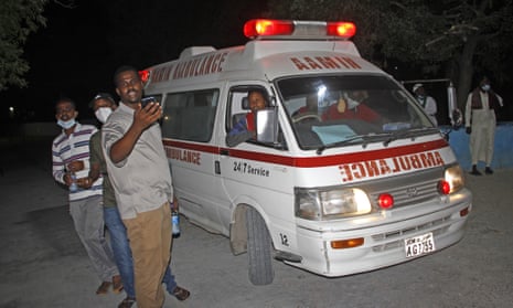 An ambulance carrying wounded from a blast at a popular restaurant arrives a hospital in the capital Mogadishu, Somalia