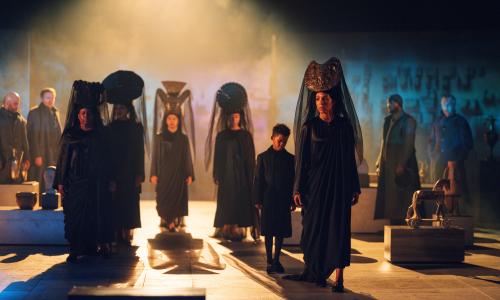A convoy of women in widow’s weeds … the cast of Coriolanus.