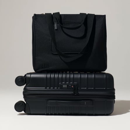 black carry-on suitcase and tote bag