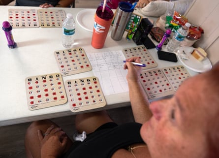 People play bingo inside the manor house.