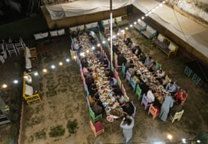 Muslims gather for an iftar meal offered by the Christian community of Mosul, Iraq