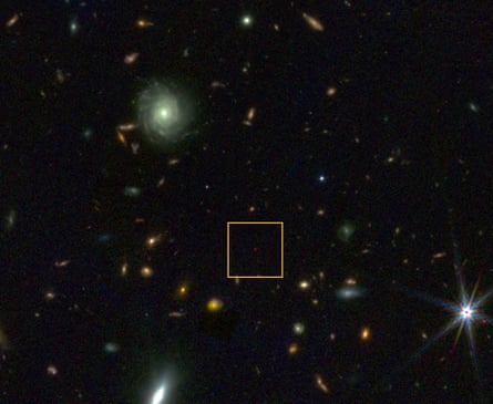 A red dot is highlighted in space