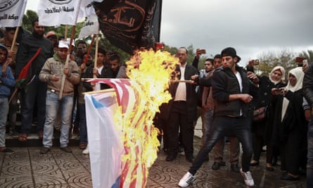 Palestinian demonstrators burn representations of Israeli and American flags during a protest in Gaza city against the US decision to recognise Jerusalem as Israel’s capital