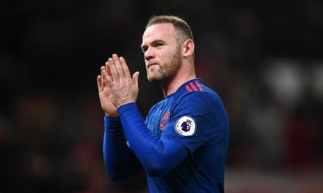 Wayne Rooney applauds the fans after scoring late.