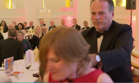 The Conservative MP Mark Field shoves a protester against a pillar then grabs her by her neck