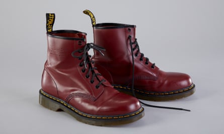 A pair of Doc Marten boots in oxblood-coloured leather with thick cushioned soles 