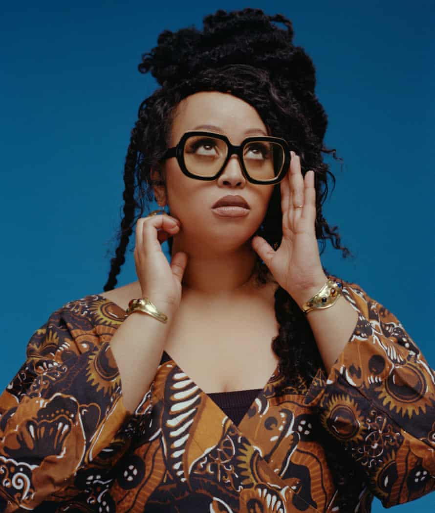 Head shot of poet Warsan Shire against blue background, Los Angeles, January 2022