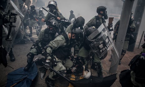 Police restrain a protester during demonstrations in the Wan Chai district of Hong Kong last year. 