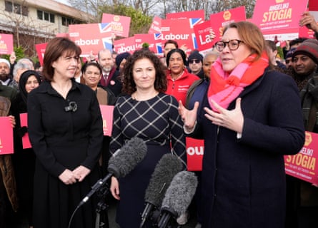 Lucy Powell, Angeliki Stogia and Anna Turley surrounded by activists with banners