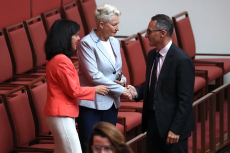 Greens leader Richard Di-Natalie congratulates Kerryn Phelps and Julia Banks as the medivac bill passes in the senate chamber of Parliament House, Canberra this morning.