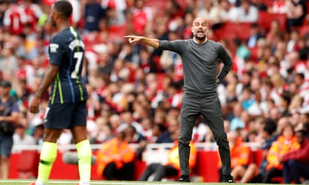 Manchester City manager Pep Guardiola shouts instructions towards Raheem Sterling, who scored against Arsenal on Sunday.