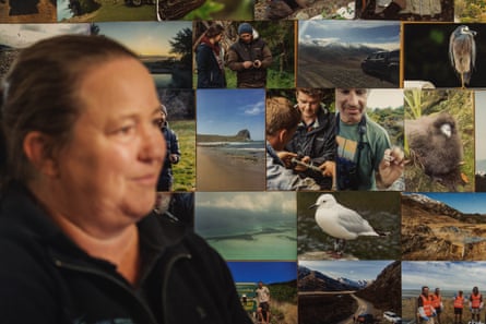 Elizabeth Bell at her Blenheim HQ by a montage of photos showing the work of Wildlife Management International