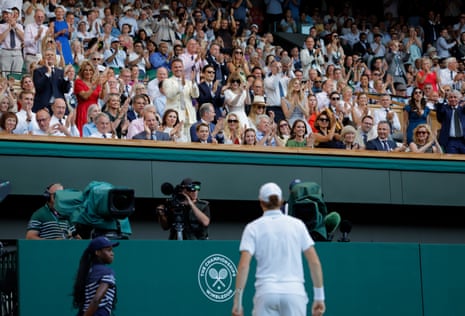 Some members of the Royal Box stand to applaud a point won by Jannik Sinner in his victory over Alexander Zverev.