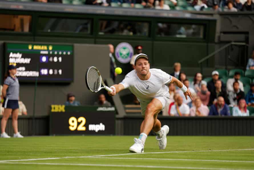 Australia’s James Duckworth returns the ball to Britain’s Andy Murray.