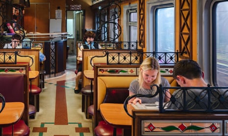 Passengers reading guidebooks aboard the Trans-Siberian Railway.