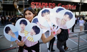 A fan awaits the BTS concert as part of the “Love Yourself” North American Tour at Staples Center, before the pandemic.