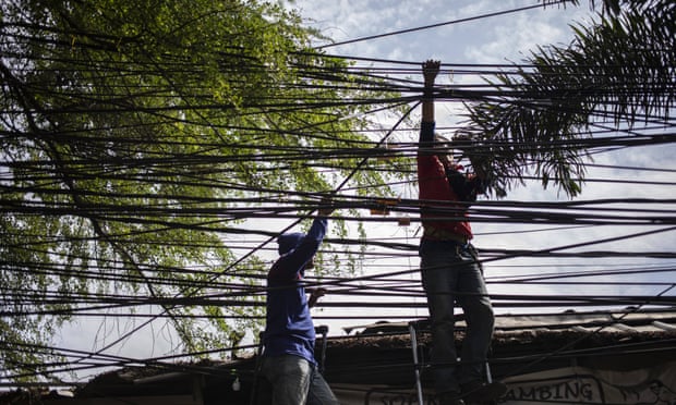 People holding overhead internet cables