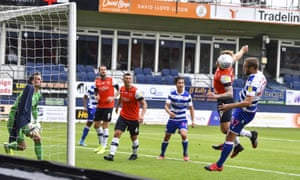 George Puscas (right) heads in Reading’s fourth.