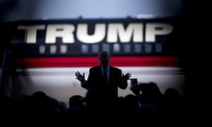 Donald Trump is silhouetted against his plane as he speaks during a campaign stop in Bentonville, Arkansas, in 2016. He also put his name on the ill-fated Trump Shuttle’s aircraft.