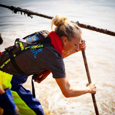 Sarah Holmyard lifting floats at the mussel farm