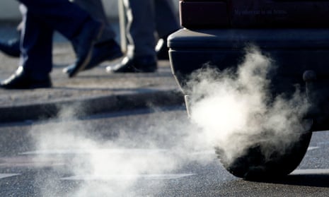 An exhaust pipe of a car feeds smoke into the air