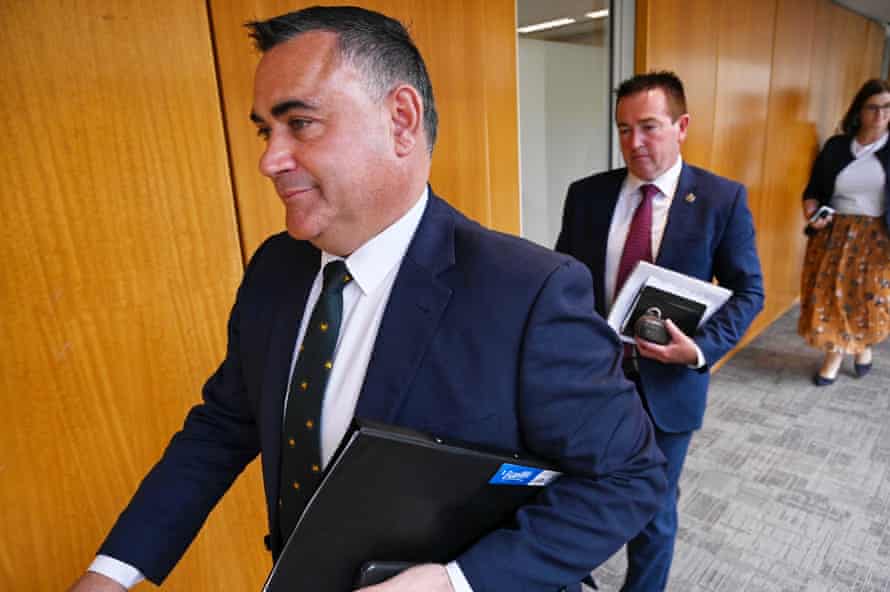 Deputy premier of NSW John Barilaro (left) leaves a National party meeting on Tuesday.
