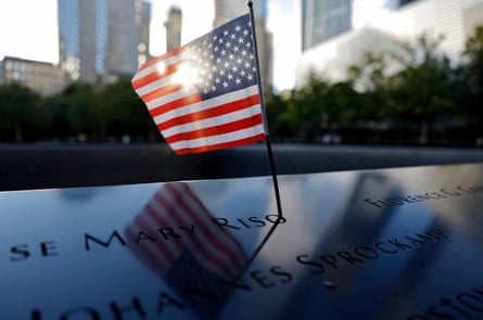 A small US flag is placed at a memorial