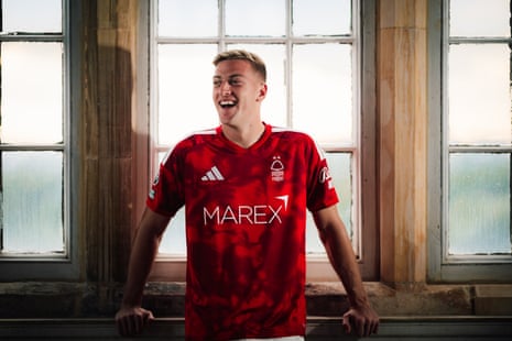 Liam Delap poses after signing for Nottingham Forest