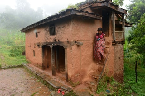 Maysara Hamal descends the stairs at her home to meet a Nepalese community health volunteer 