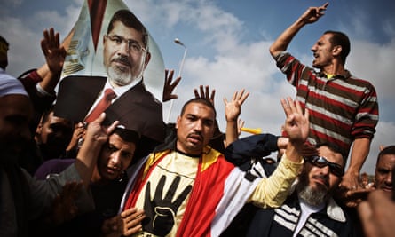 Egyptian supporters of the Muslim Brotherhood protest outside the trial of ousted president Mohamed Morsi in Cairo in 2013.