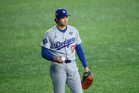 Shohei Ohtani warms up ahead of Saturday night’s first pitch.