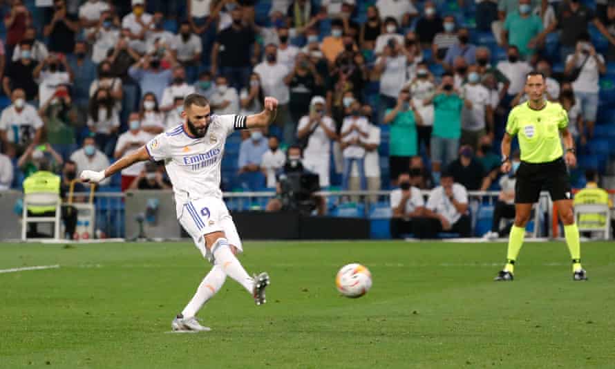 Karim Benzema scores Real Madrid’s fifth goal from the penalty spot to complete his hat-trick.