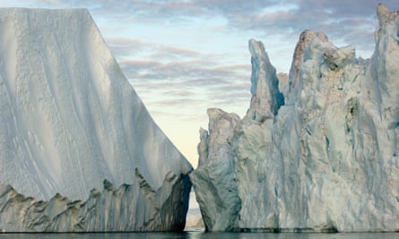 Ice broken off from the Greenland Ice Sheet floats into the North Atlantic in Ice: Portraits of Vanishing Glaciers by James Balog.