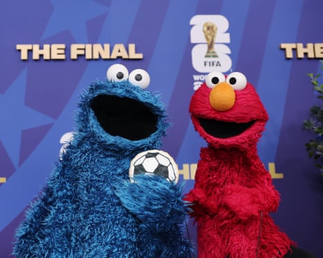 Cookie Monster and Elmo attend the final.