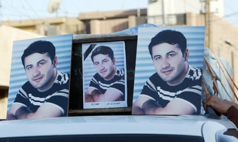 Pictures of Namir Noor-Eldeen atop his coffin
