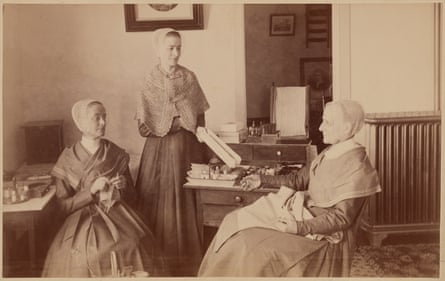A cabinet card photograph of Shaker sisters Martha Jane Anderson, Grace Bowers, and Anna White in the North Family Sewing Room, Mount Lebanon, New York, circa 1890 – 1910.