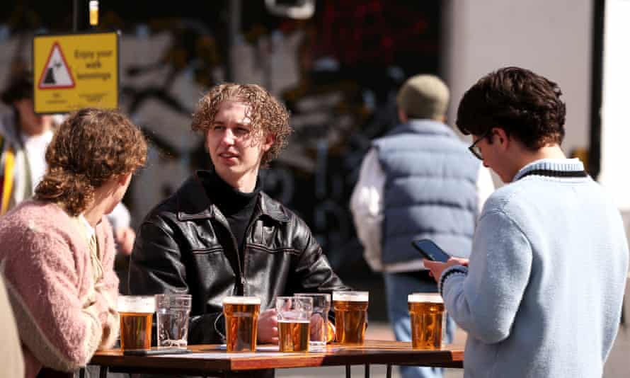 People are seen enjoying drinks in outdoor beer gardens on April 12, 2021 in Manchester, England.