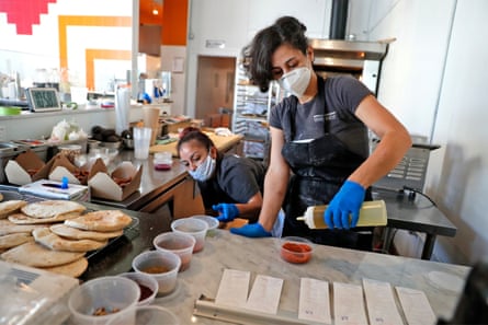 Reem Assil and Wendy Giron prepare food at Reem’s California.