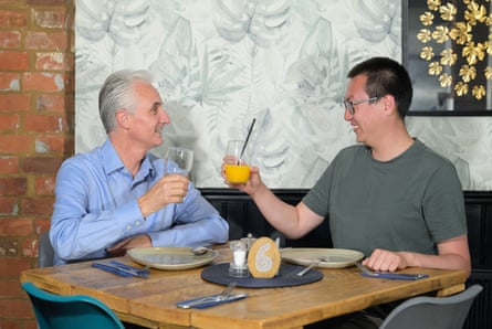 Phill and Joe raise their glasses
