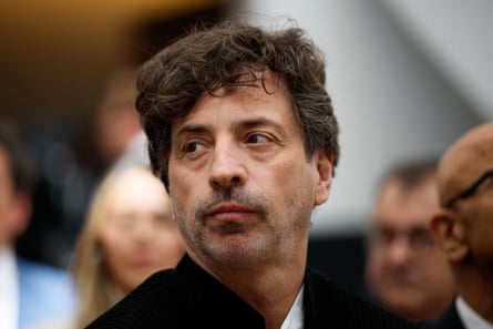 a man looks off to the side