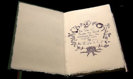 One of only seven copies of a handwritten and illustrated book by British author J.K. Rowling titled The Tales of Beedle the Bard is on show at Sotheby’s auction house in London on December 9, 2016. / AFP PHOTO / Justin TALLISJUSTIN TALLIS/AFP/Getty Images