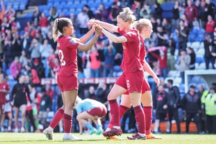 Liverpool’s Taylor Hinds and Jasmine Matthews celebrate at the final whistle.