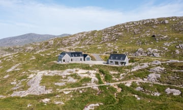 Timber-framed homes nestling in the rugged countryside of the Isle of Harris, Scotland